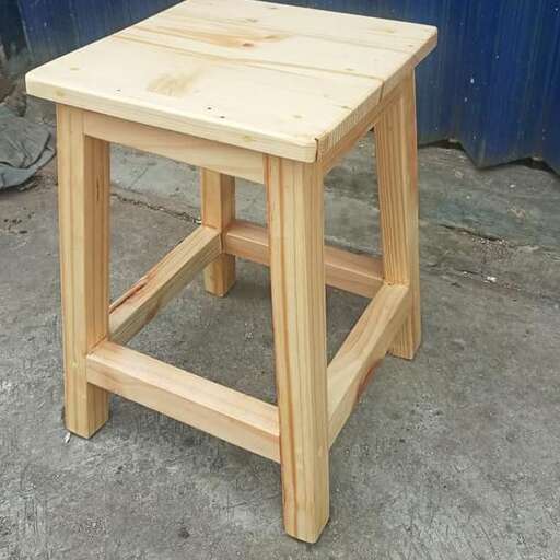 a small table made from a single piece of wood