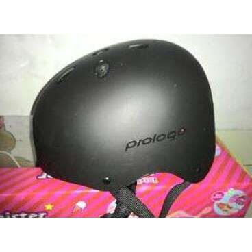 a black helmet with a pink towel on it.