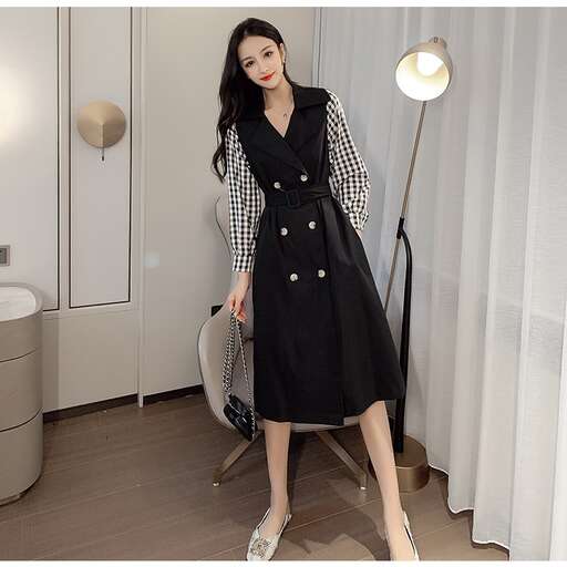 the dress is black and white with buttons.