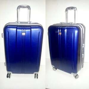 a blue suitcase with wheels on the ground.