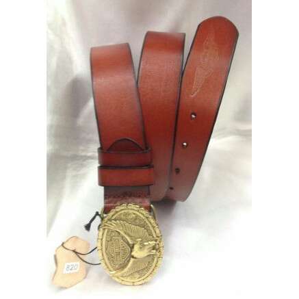 a leather belt with a gold medal