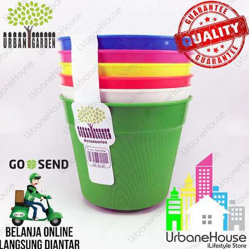 a green plastic cup with a white straw