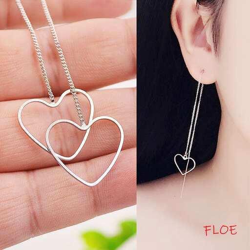 a heart shaped pendant with a heart shaped heart on the side.