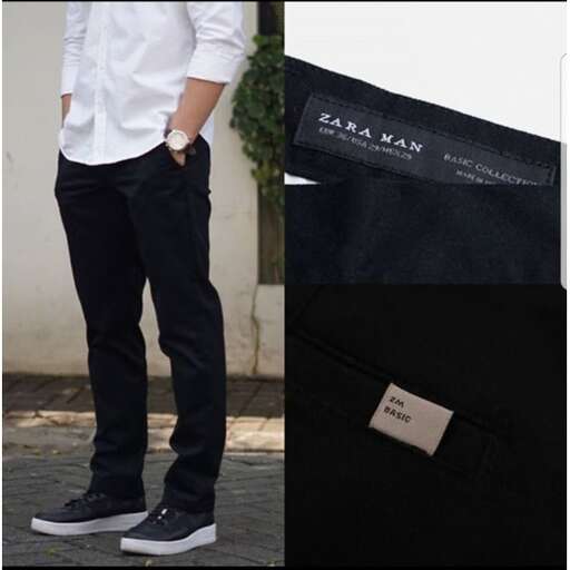 a man in black pants and white shirt
