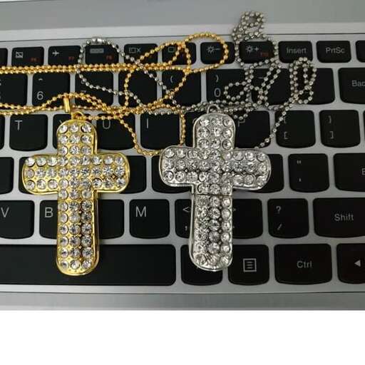 a key chain with a cross and chain on it.