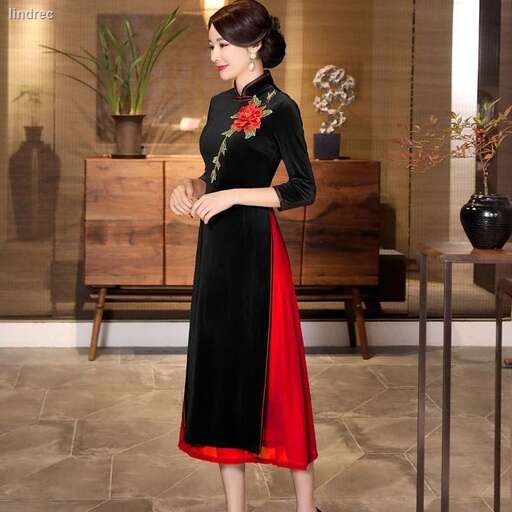 a woman in a black and red dress