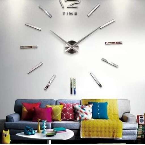 a living room with a couch, table, and a large clock.
