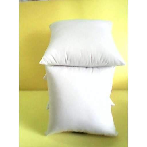 a pillow that is made of white cotton.
