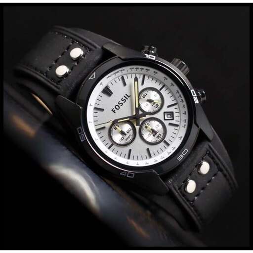 a watch with a leather strap and a black leather strap.