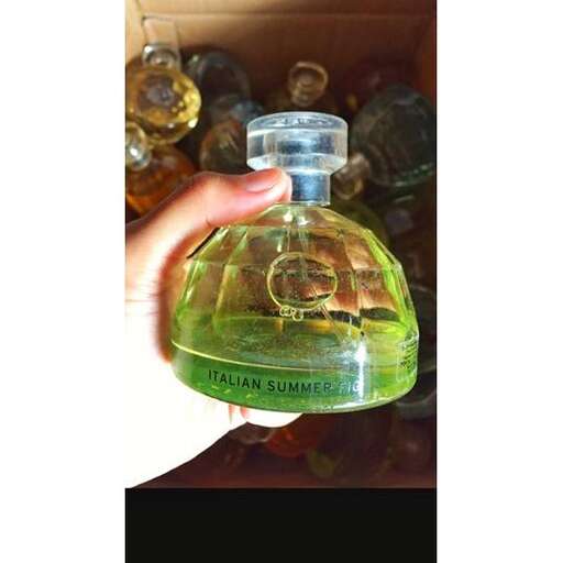 a bottle of perfume in a box