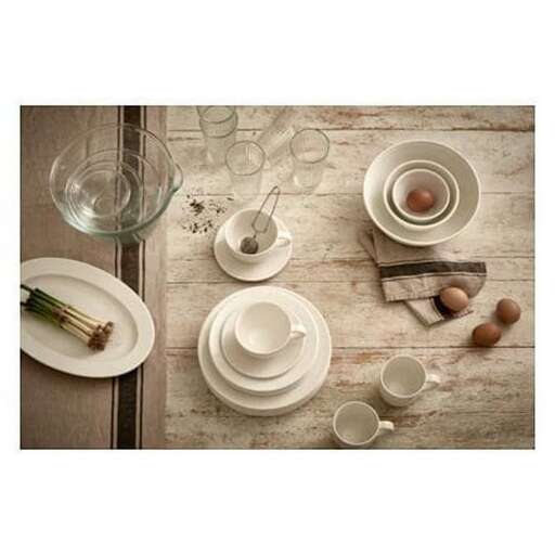 a table with two cups and a cup of tea.