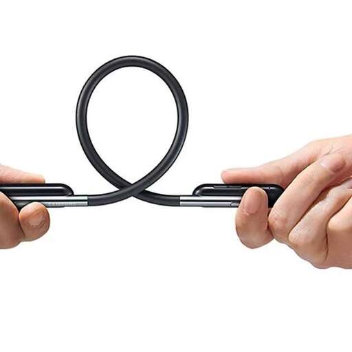 a hand holding a pair of scissors and a ring.
