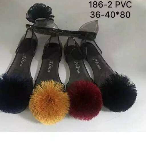 a set of bristles and pom pom on a white background.