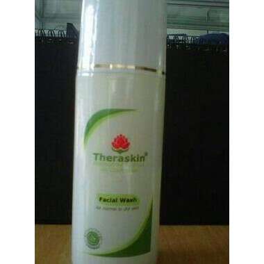 a white bottle of shampoo on a table.