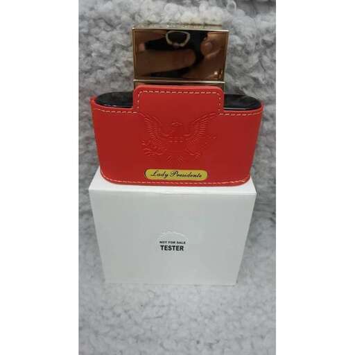 a red leather wallet with a gold buckle.