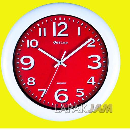 a clock with a red face and a white frame.