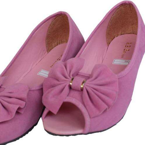 i have a pair of pink shoes in my room.