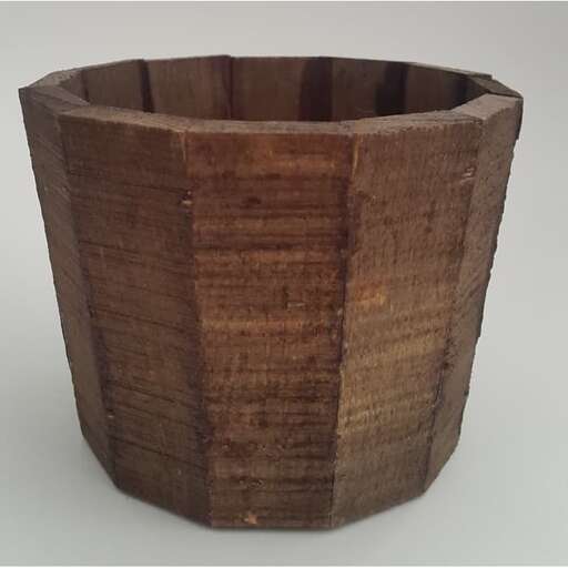 a wooden bowl made from a tree trunk.