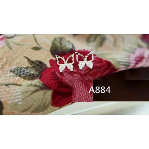 a set of three - dimensional butterflies on a red flower.