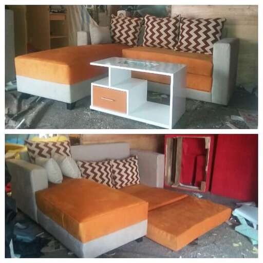 a couch made out of pallets and a coffee table
