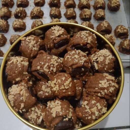 a bowl of chocolate muffins with chocolate chips.