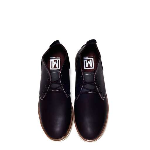 a pair of black suede shoes with a white logo