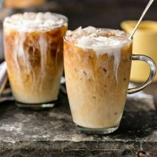 a picture of a coffee mug with a spoon.