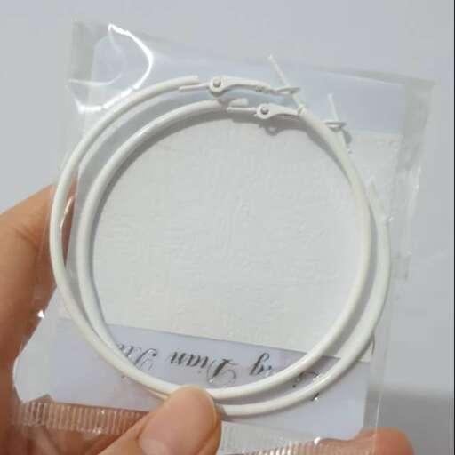 the bracelet is made of white thread.