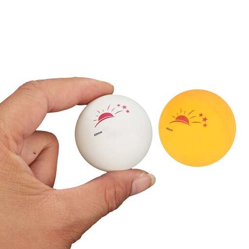 a hand holding a ball and a small orange and yellow ball.