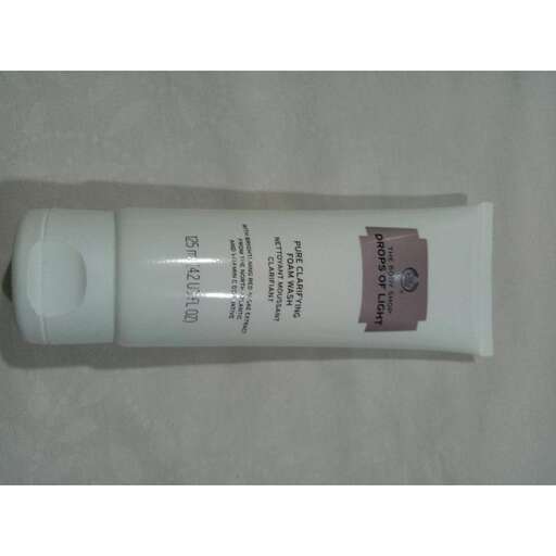 a white bottle on a white surface.