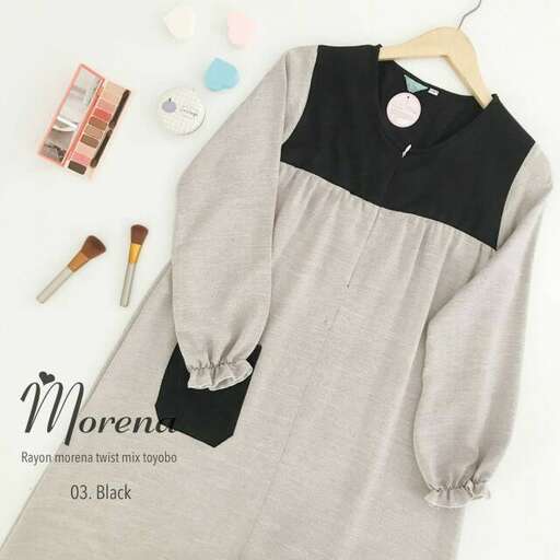 a black and white dress with a little bit of color.