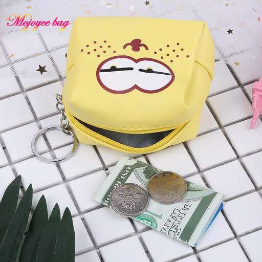 a bag with a face on it and a coin in it.