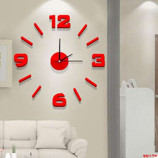 a wall clock with red numbers.