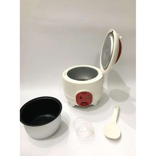 a cup and spoon are sitting on a table.