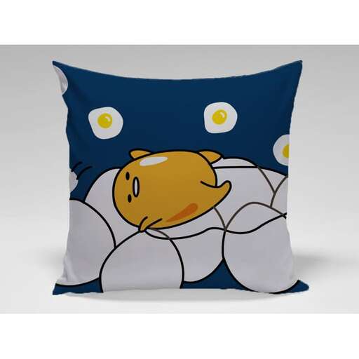 pillow with a face and a fish on the side.