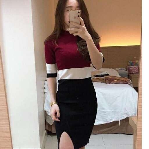 a woman in a black and white dress and a black pencil skirt.