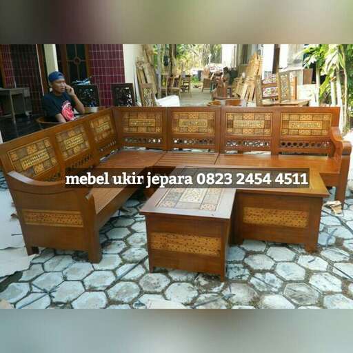 a wooden bench with a table and chairs.