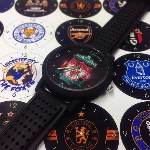 a close up of a black watch with a black strap