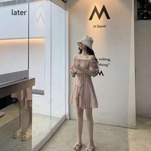 a woman in a dress and hat standing in front of a display.
