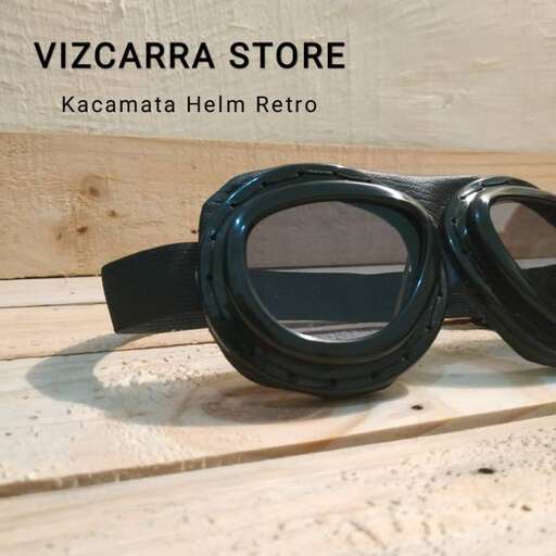 a pair of goggles with a black strap.
