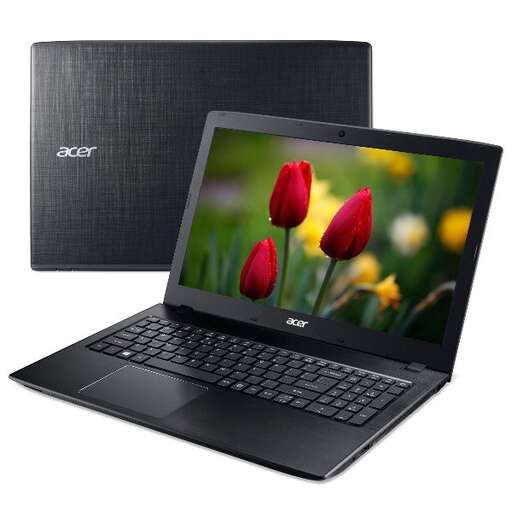 a laptop computer with tulips in the background