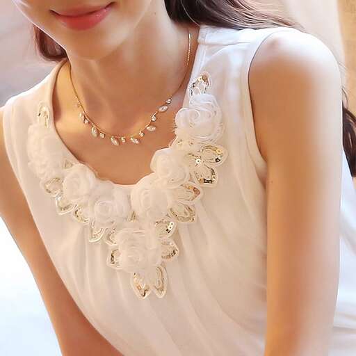 white lace top with a pearl necklace