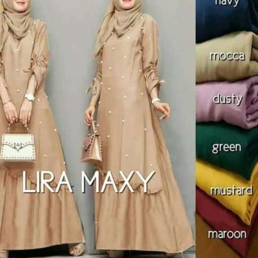 a woman in a long beige dress