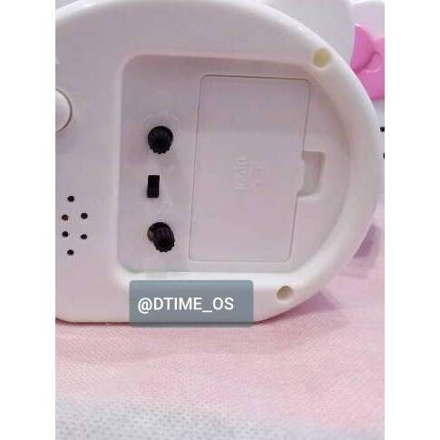 a white electric appliance with a pink flower in the middle.