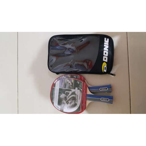 a bag with a picture of a man and scissors.