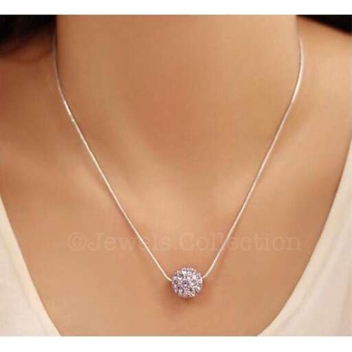 a diamond necklace with a diamond in the middle.