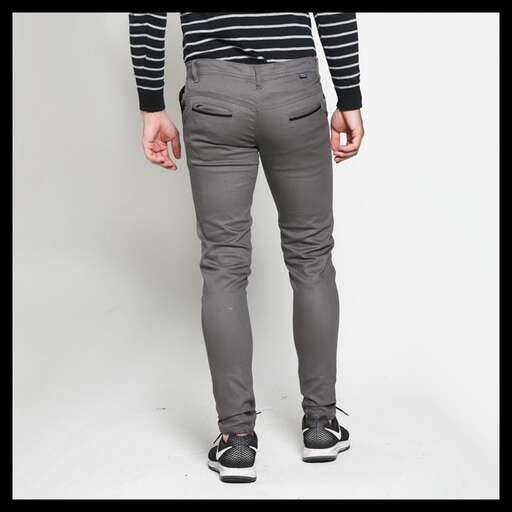 a pair of men's jeans with a striped t - shirt.