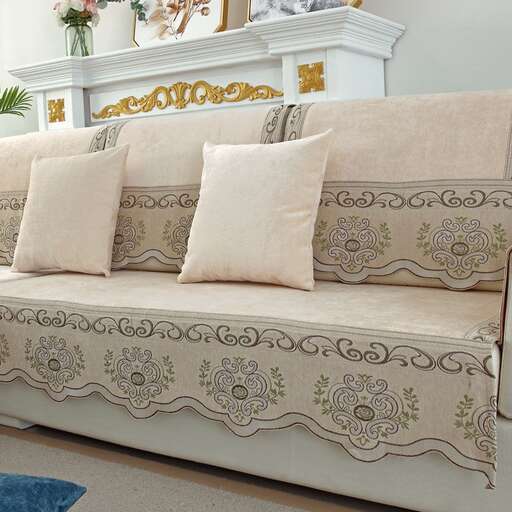 a white couch with a white pillow on it.