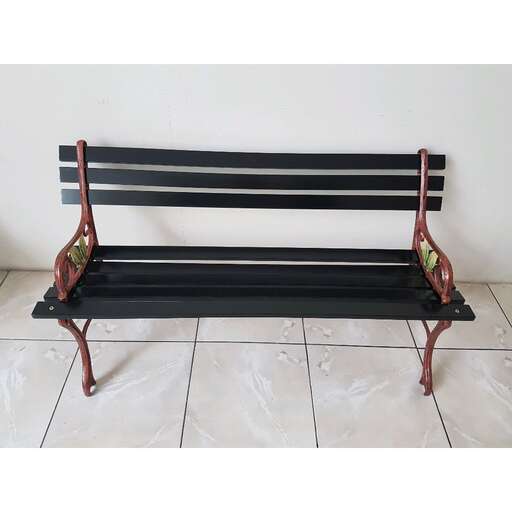 a black bench with a white tile floor