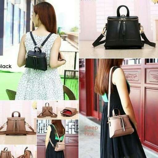 a woman in a black dress and a black bag